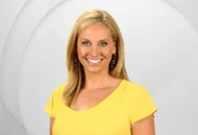 Kara Sundlun smiling on WFSB set with Emmy award, representing her 25-year journalism career from hidden family roots to broadcast excellence in Connecticut.