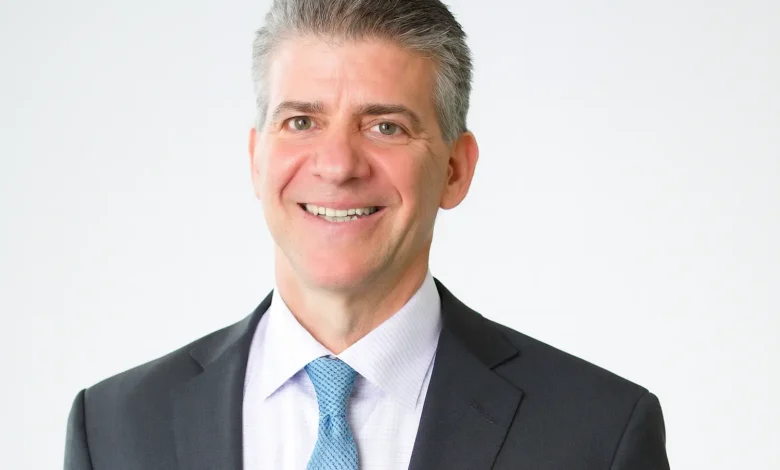 Allan Bruce Rothschild and Kitt Shapiro on their wedding day in 2002, smiling softly in formal attire with Eartha Kitt looking on proudly – symbolizing enduring love and legacy.