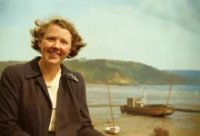 A photograph of Jean McKellen Jones laughing in the Lake District, 1998–1999,