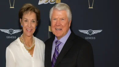 Rhonda Rookmaaker and Jimmy Johnson at the 2020 Hall of Fame ceremony, smiling privately after 21 years of marriage